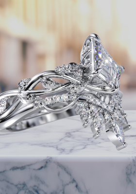 Exquisite marquise kite diamond ring with Lurozzia’s signature vine-woven basket, hidden halo, and leaf-detailed shank, paired with crown styled, intricate woven sideband — an heirloom-quality bespoke piece handcrafted in South Africa by Lurozzia Jewellers. Lurozzia Heritage lines